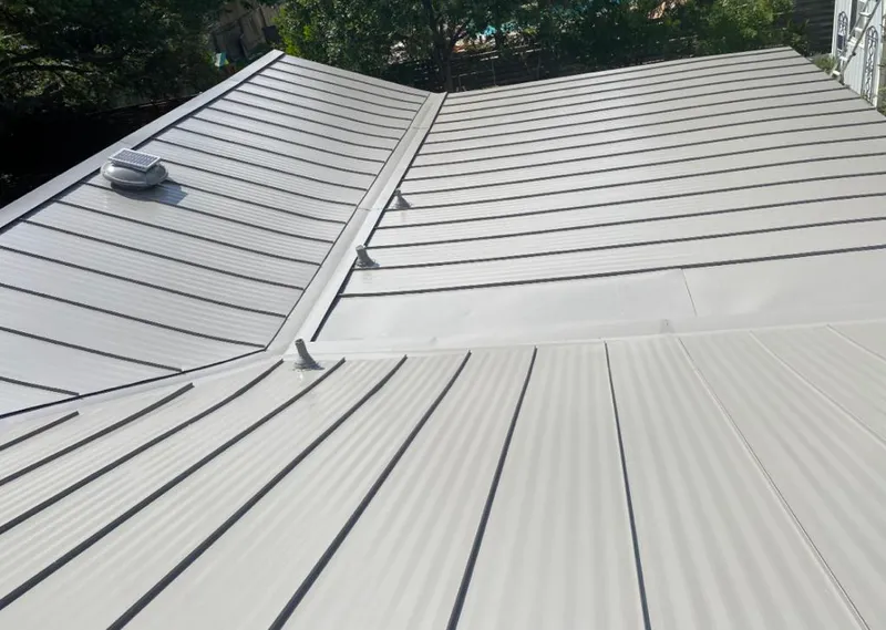 Solar attic fan installed on a metal roof for Roof Ventilation in Carteret